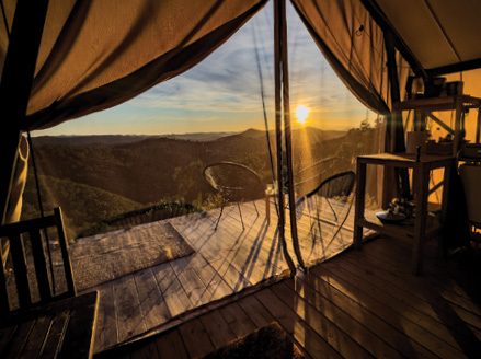 The view from inside the tent across the hills at golden hour
